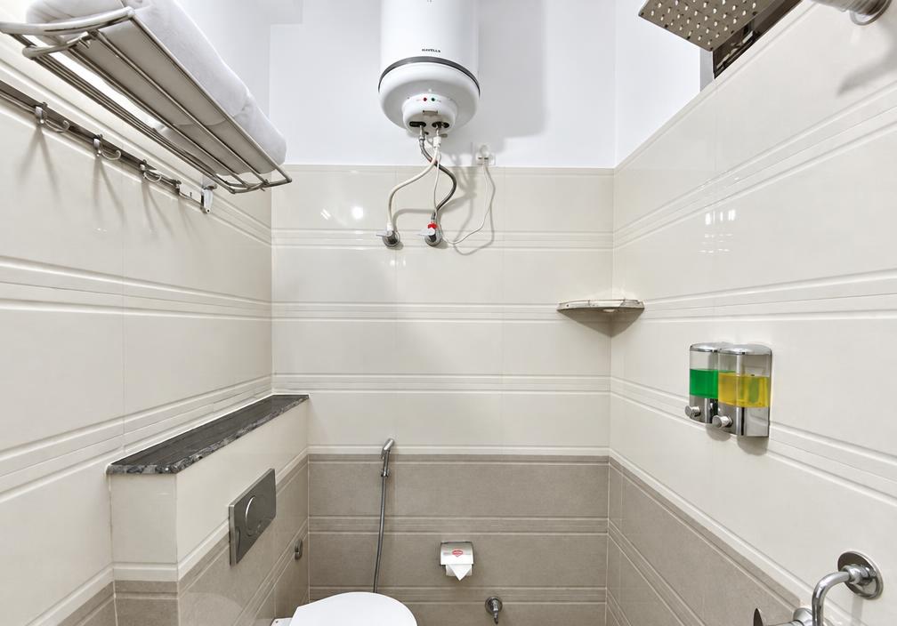 Spotless bathroom at Tapovan New Residency with 24x7 hot water geyser